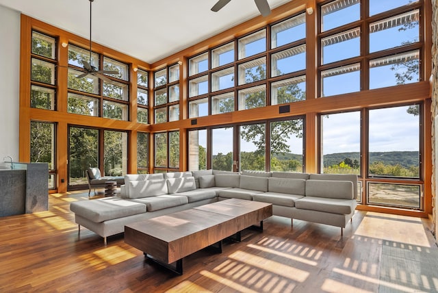 274 Joshuatown Rd, Lyme, CT 06371 - living room with a towering ceiling, a ceiling fan, and wood finished floors