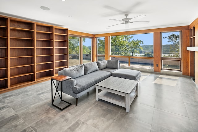 living room with a healthy amount of sunlight and ceiling fan