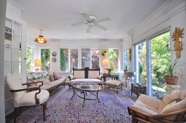 sunroom featuring ceiling fan