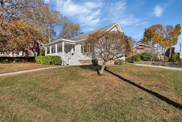 view of front facade with a porch and a front yard