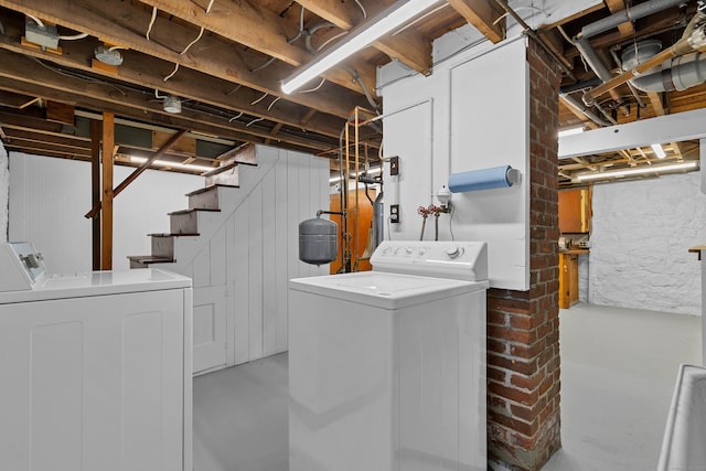 laundry room with independent washer and dryer