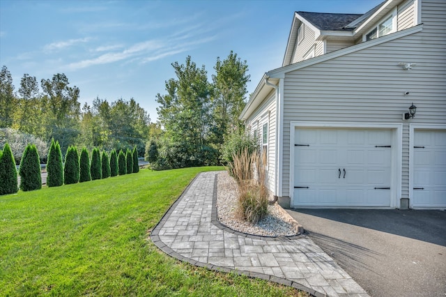 view of yard featuring a garage