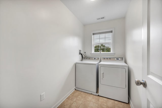 laundry area with separate washer and dryer