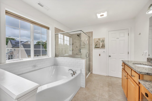 bathroom with vanity, plus walk in shower, and tile patterned floors