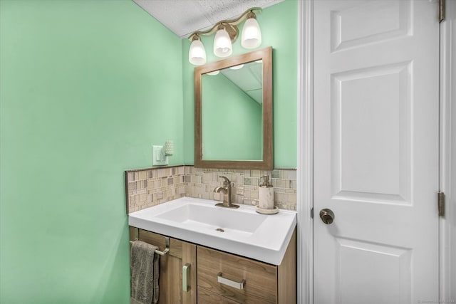 bathroom featuring decorative backsplash and vanity