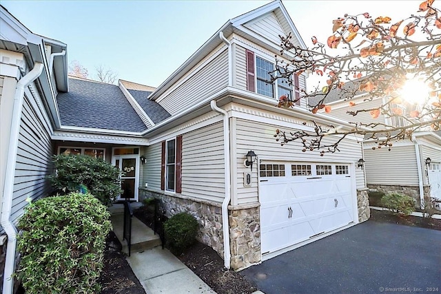 view of property exterior featuring a garage