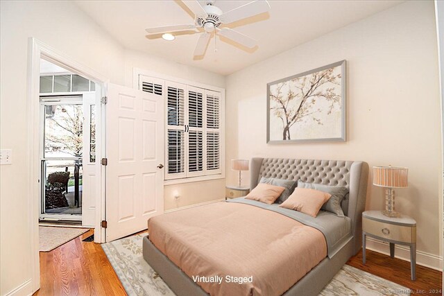 bedroom with hardwood / wood-style flooring and ceiling fan