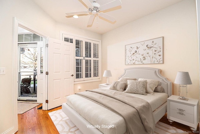 bedroom with wood-type flooring and ceiling fan