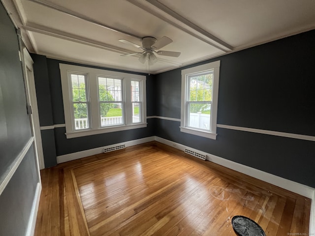 unfurnished room with wood-type flooring and ceiling fan