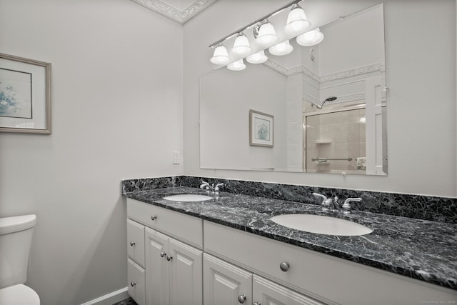 bathroom featuring walk in shower, vanity, and toilet