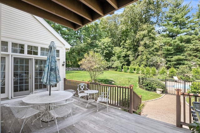 wooden terrace with a yard