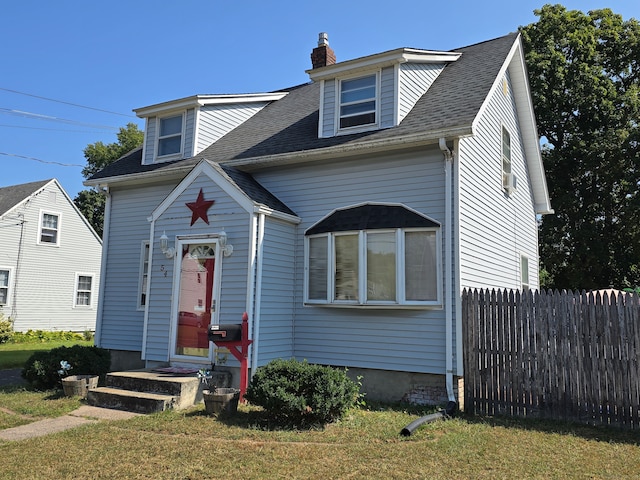 new england style home with a front yard