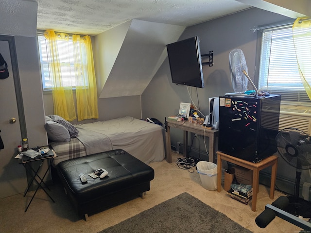 carpeted bedroom featuring vaulted ceiling, multiple windows, and a textured ceiling