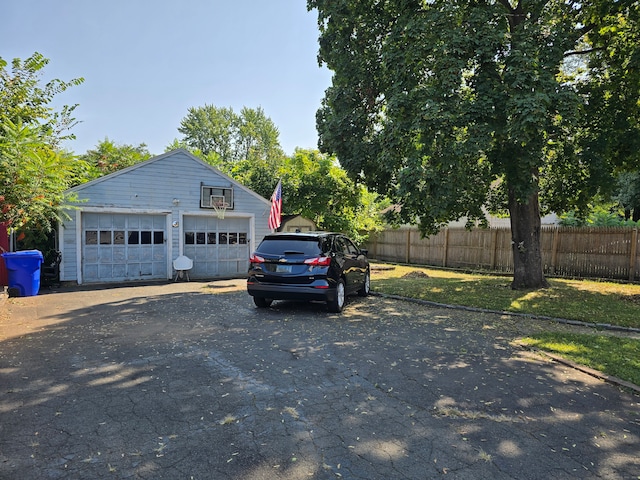 garage featuring a yard