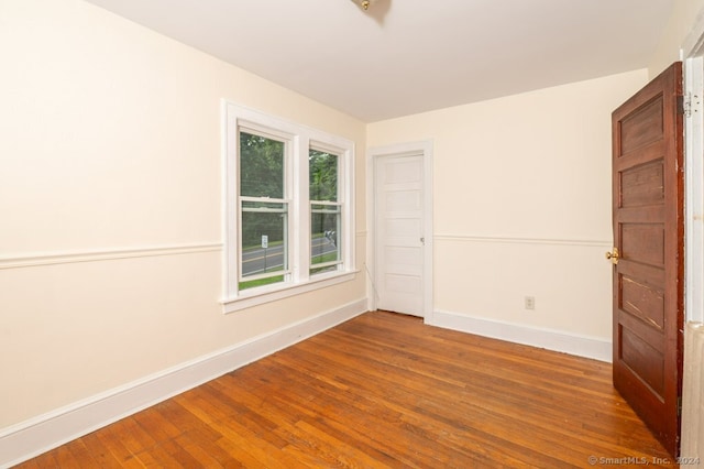 spare room featuring hardwood / wood-style flooring