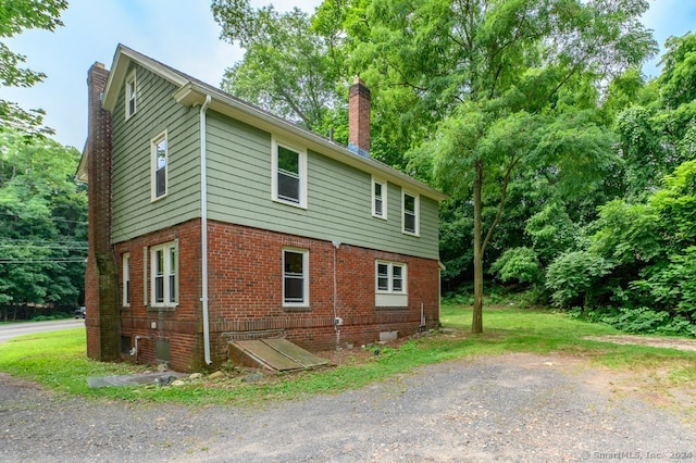 view of side of property with central AC