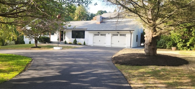 single story home with a garage