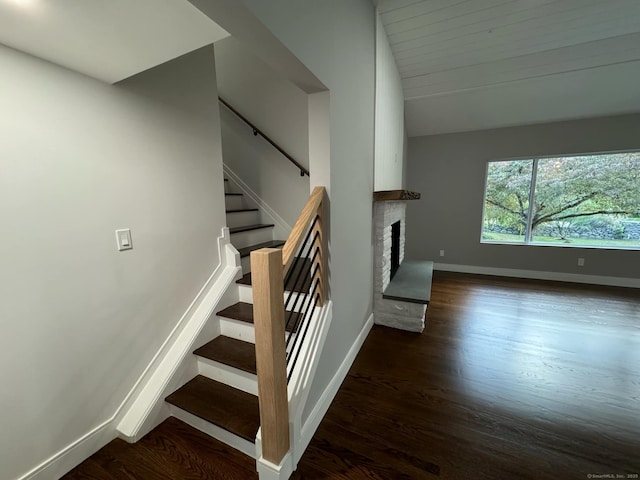 stairs with hardwood / wood-style floors