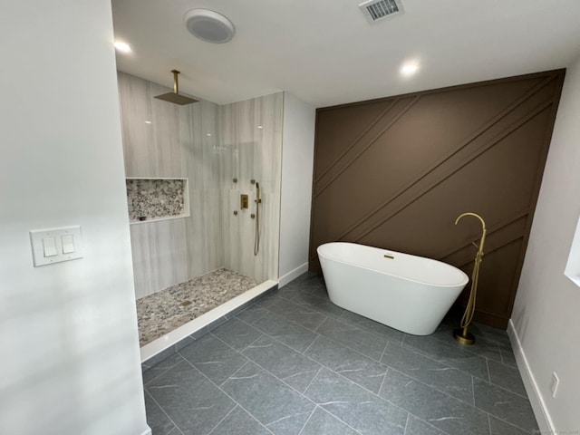 bathroom with separate shower and tub