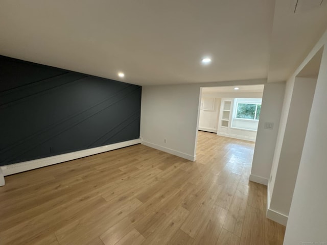 spare room featuring light hardwood / wood-style flooring