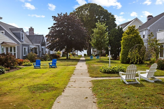 view of home's community with a lawn