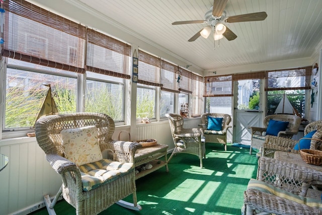 sunroom / solarium featuring ceiling fan