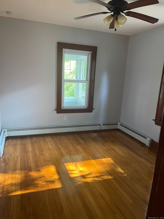 unfurnished room with wood-type flooring and ceiling fan