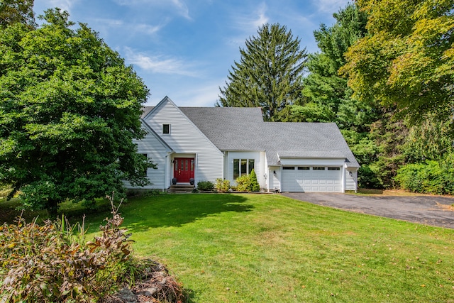 view of front of home featuring a garage and a front yard