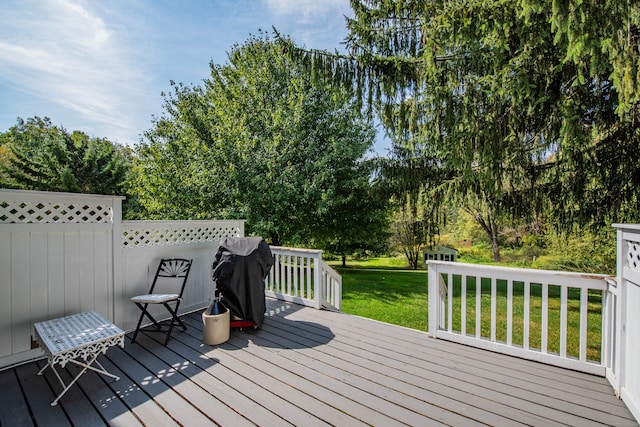 wooden deck with a yard