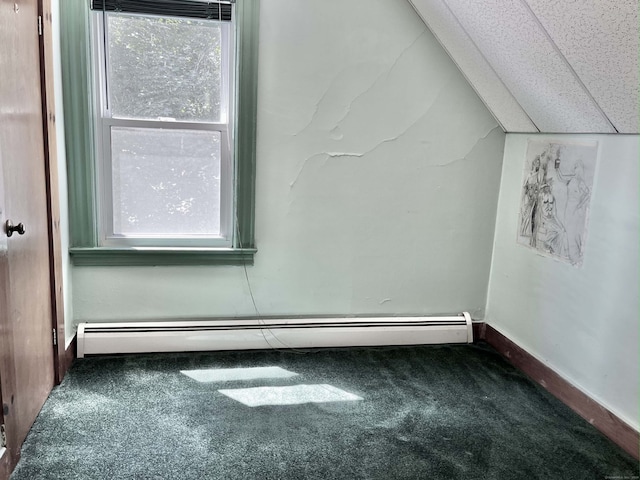 bonus room with lofted ceiling, dark colored carpet, and a baseboard heating unit