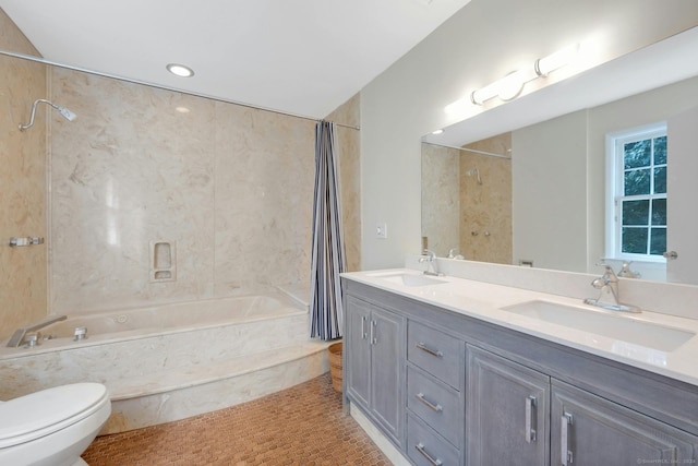 full bathroom featuring vanity, shower / tub combo, and toilet