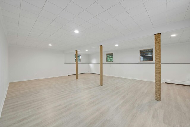 basement featuring light wood-type flooring