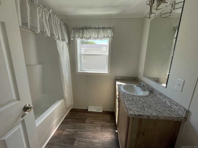 bathroom featuring shower / tub combo with curtain, vanity, and wood-type flooring