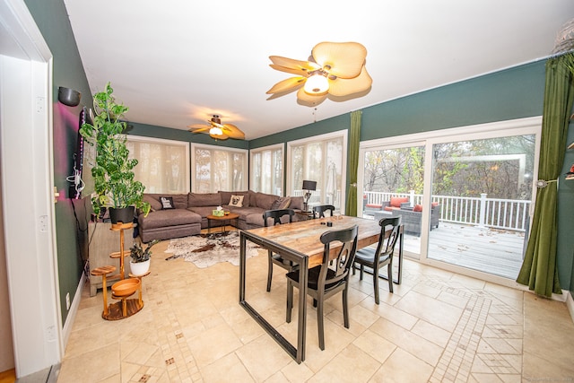 tiled dining room with ceiling fan