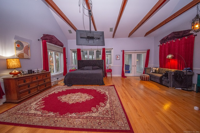 bedroom featuring french doors, high vaulted ceiling, hardwood / wood-style flooring, and beamed ceiling