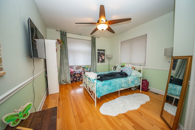 bedroom featuring ceiling fan and light hardwood / wood-style flooring