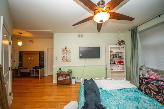 bedroom featuring ceiling fan and light hardwood / wood-style floors