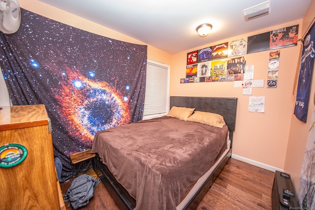 bedroom with hardwood / wood-style floors