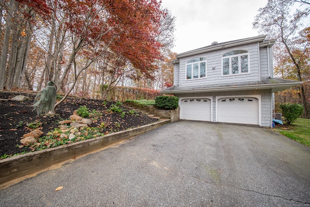 view of side of home featuring a garage