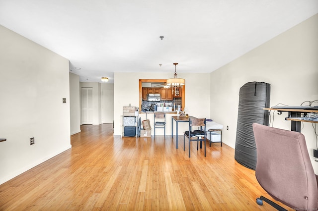 office space with light hardwood / wood-style flooring