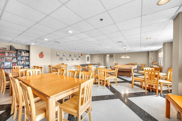 dining room with a paneled ceiling