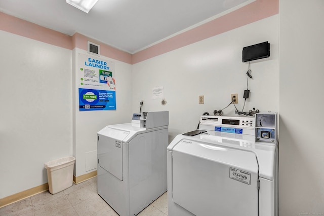 laundry room with washing machine and clothes dryer