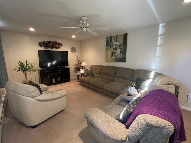 carpeted living room with ceiling fan