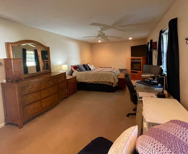 carpeted bedroom with ceiling fan