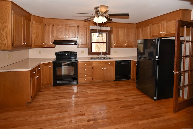 kitchen with ceiling fan, light hardwood / wood-style flooring, black appliances, and sink