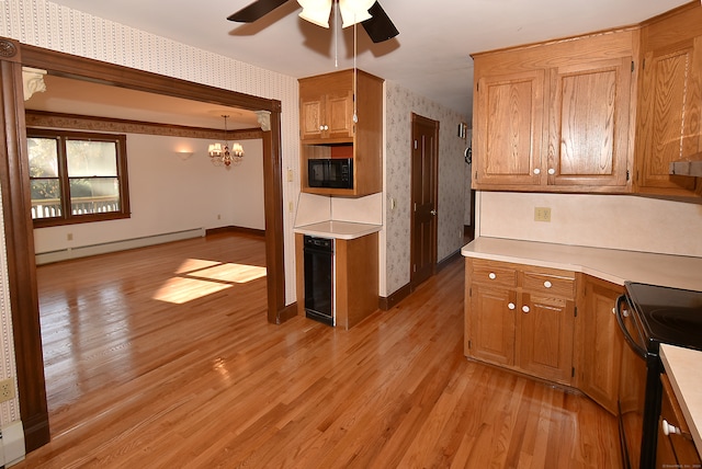 kitchen with ceiling fan with notable chandelier, a baseboard radiator, light hardwood / wood-style flooring, and black appliances