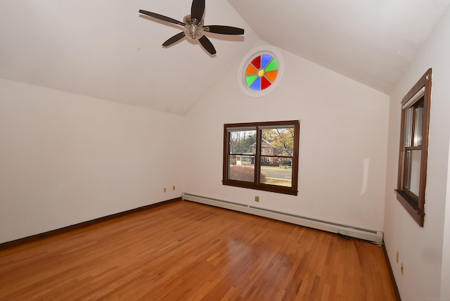 interior space featuring light hardwood / wood-style floors, vaulted ceiling, baseboard heating, and ceiling fan