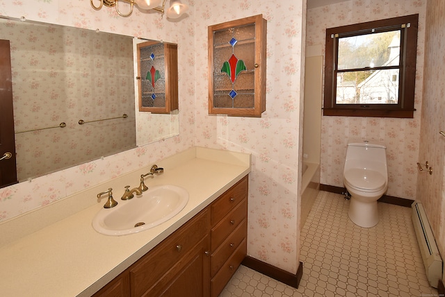 bathroom featuring tile patterned flooring, vanity, a baseboard radiator, and toilet