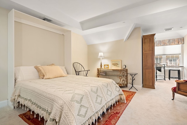 carpeted bedroom featuring vaulted ceiling