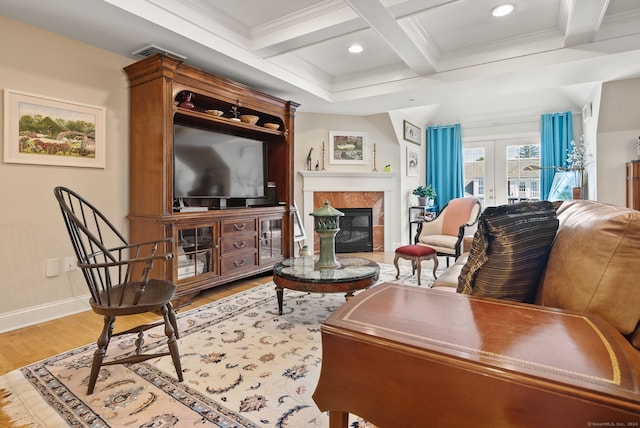 living room with french doors, coffered ceiling, beamed ceiling, crown molding, and hardwood / wood-style flooring